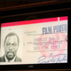 Don Hogan Charles’ photo ID was part of a slide show at his funeral. (Marilynn K. Yee)